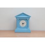 A late 20th century blue glazed porcelain mantle clock, in the neoclassical style, 21cm high