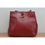 A red leather Longchamp ladies handbag, 27cm x 33cm