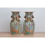 A pair of late 19th/early 20th century Chinese canton vases, famille verte pallet, panels