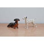 Two small Beswick ceramic dogs, A Dachshund, 9cm long and a Dalmatian 12cm long, both marked to