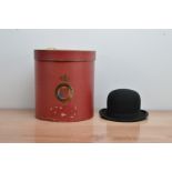 A Bowler hat, The Brella Hat' size 6 1/2, in a large red Christy's' of London hat box AF