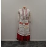 A large collection of Traditional ladies Russian clothing, adults and children, including skirts,