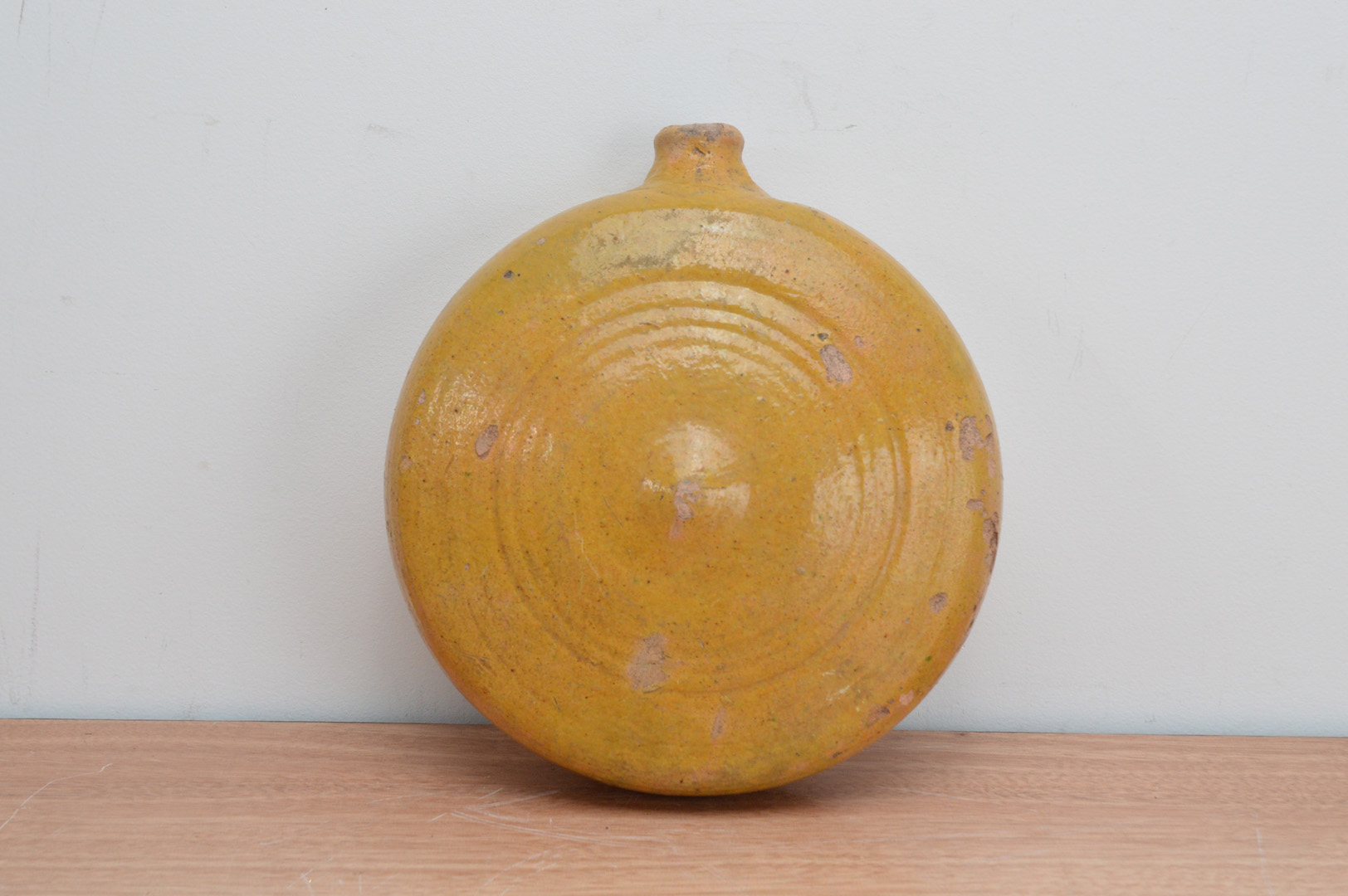 A late 18th/ early 19th century salt-glazed ceramic flattened ewer, circular in the form of a moon