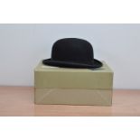 A Bowler hat, by Simpsons of piccadilly, 7 1/8, in cardboard box