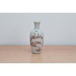 An early 19th century Chinese porcelain bottle vase, purple dragon design on a white ground, with