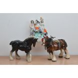 Two unmarked porcelain horse figurines, both shire horses, one with tac, 22cm & 23cm high,