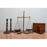 A collection of works of art, comprising a set of wood and brass kitchen scales 50cm high, a pair of