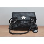 A black leather Jimmy Choo ladies handbag, the leather worn with fitted interior AF