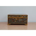 An early 20th century brass and enamel Japanese box, with Egyptian exterior design, a Japanese