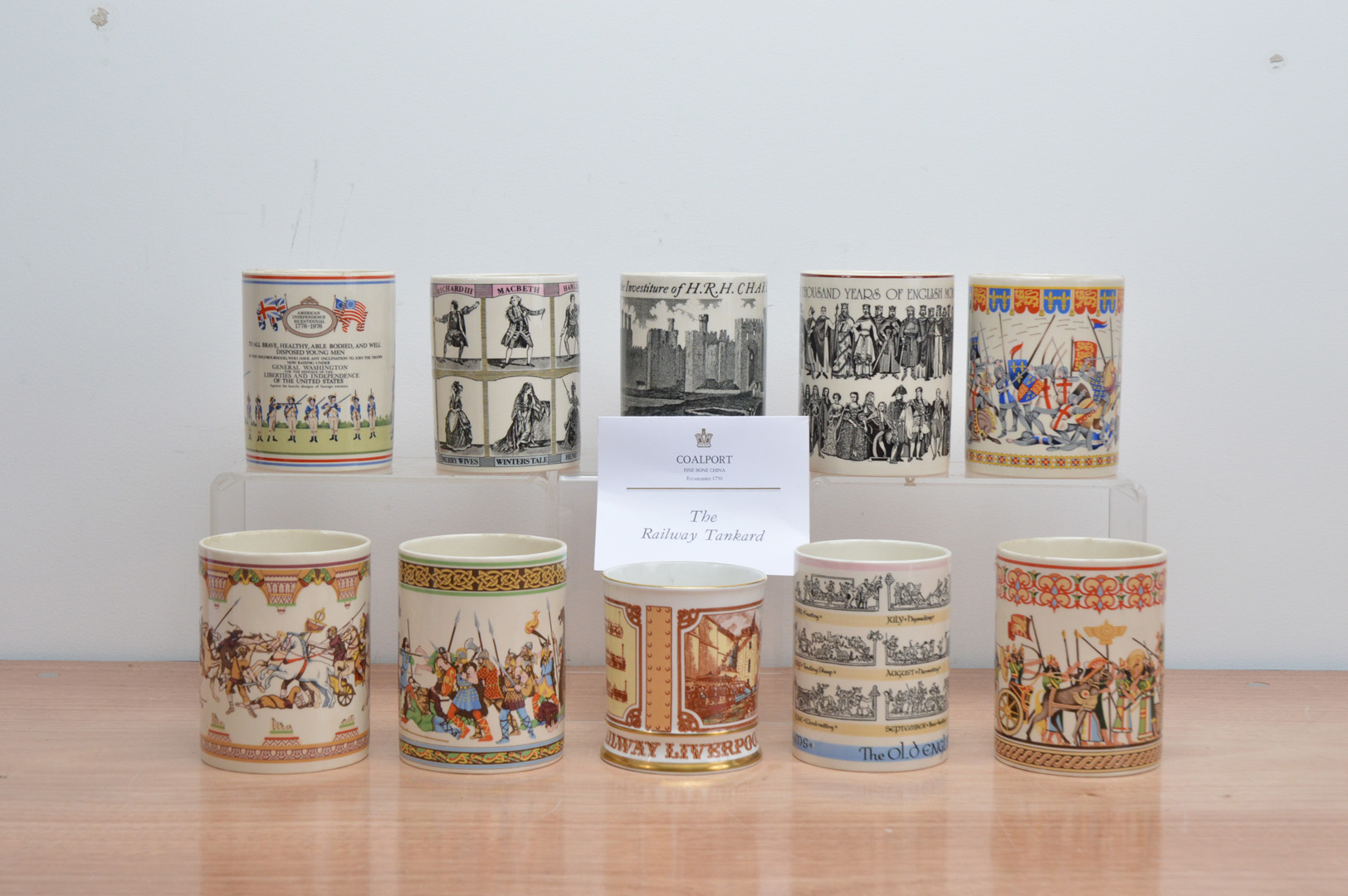 Nine modern Wedgwood commemorative mugs, together with a Coalport limited edition Railway tankard