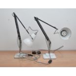 Two white 20th century Anglepoise lamps, marked to the base of the columns, some writing on them