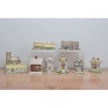 A collection of modern Coalport fine bone china houses, eight in total all marked to the underside