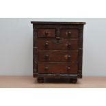 A late 19th/early 20th century miniature chest of drawers, two drawers over three, 32cm x 27cm AF