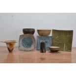 A collection of studio pottery, comprising a internally raku glazed earthenware vase with triangular