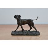 P.J. Mene (French, 1810-1879), a small bronze of a dog, screw of head and tail, on a rectangular