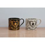 Two Wedgwood Royal family commemorative Silver Jubilee mugs, one in black and gold, no. 480 of 500