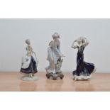 Two Royal Dux porcelain lady figurines, together with a Lladro figurine of a lady (3)