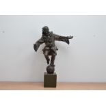 A 20th century bronze effect resin sculpture of a clown, on a square marble effect base, total