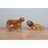 Four Beswick ceramic animal figurines, comprising a large tiger, a leopard and male and female
