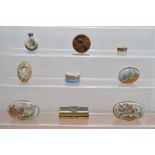 A collection of porcelain, enamel and metal boxes, comprising two porcelain Christmas themed boxes