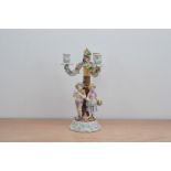 A 20th century German Porcelain candelabra, with two figures are the column, floral decoration,