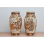 A pair of late Meiji period ceramic vases, in the satsuma style, panels depicting figures and