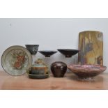 A collection of studio pottery, comprising a tenmoku glazed stoneware jar by Nan Wilson impressed