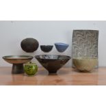 A collection of studio pottery, comprising a stoneware pot and cover with raku green and black glaze