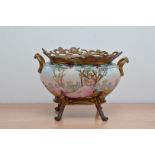 A turn of the century French twin handled Porcelain and metal mounted jardiniere, floral