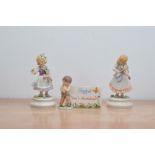 Two Goebel figurines of children, both in retail boxes, together with a figural plaque 'Loves