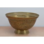 An early 20th century Chinese brass bowl/centre-piece, scrolling dragon design, with mark to the