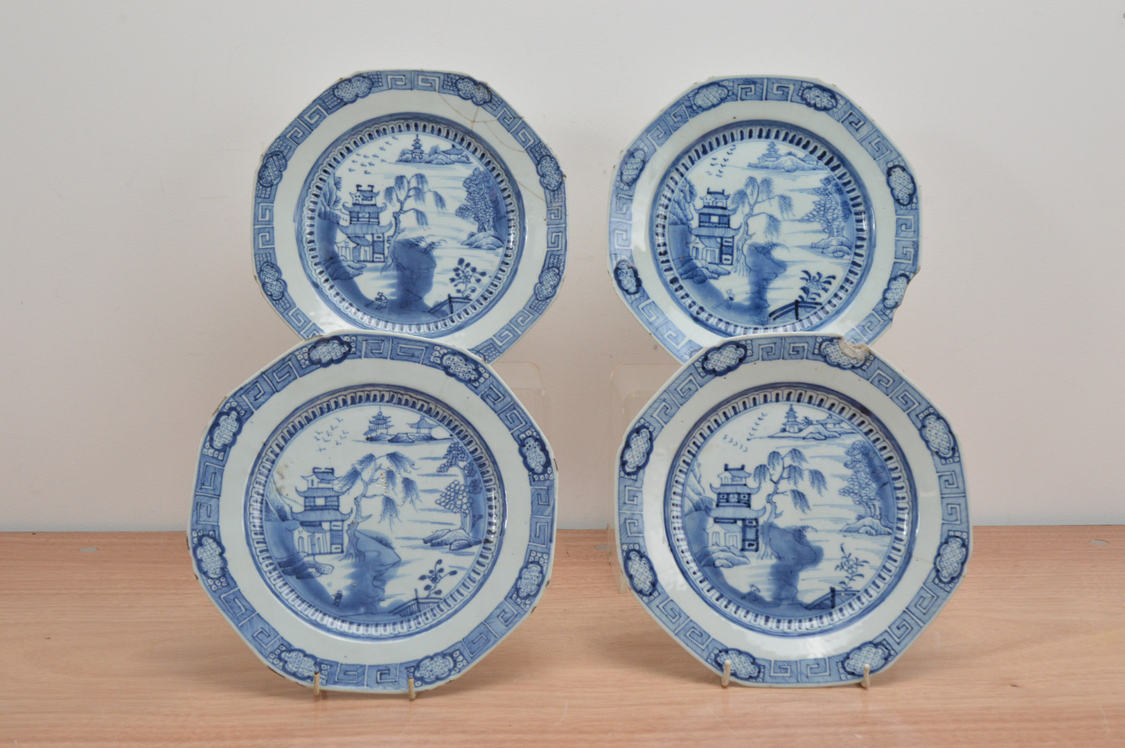 Four early 19th century Chinese porcelain octagonal blue and white plates, with a Willow pattern