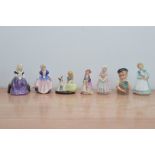 A collection of Royal Doulton figurines and one small character jug, comprising the Paisley Shawl,