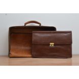 A 20th century brown leather document holder, 27.5cm x 38cm, together with a worn leather bag, AF (
