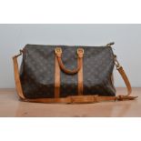 A leather Louis Vuitton style bag, duffel bag, with shoulder strap, some of the leather stained, AF,