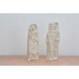 A pair of studio pottery white glazed porcelain figures by Jean Derval, in the form of medieval