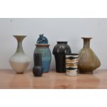 A collection of studio pottery, comprising a baluster narrow necked stoneware vase with grey faded