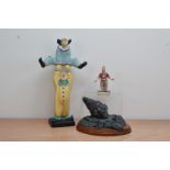 A bisque 20th century ceramic figurine of two clowns, 43.5cm high, with a smaller ceramic figure