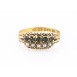 A Victorian 15ct gold emerald and seed pearl ring, the two pairs of parallel five stones set in a