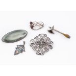 A WMF Ikora white meal pierced brooch, with open work design 4.5 cm, together with an oval Ruskin