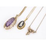 Three gold pendants and necklaces, including a n oval amethyst, a white sapphire and a back basalt