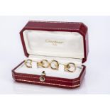 A pair of Cartier 18ct gold cufflinks, The horse-bit links, marked 750, stamped Cartier in script,