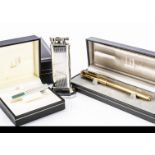 A Dunhill ballpoint pen and lighter and a tie pin, all boxed
