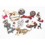 A quantity of costume brooches all modelled as various animals, including a gilt metal tiger, a