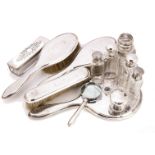 A small group of silver and glass dressing table items, including a set with pair of hair brushes,