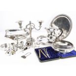 A collection of silver and silver plate, including a pair of silver candlestick sconces, a pair of