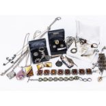 A collection of wite metal and silver, including a Thomas Sabo cross, an amber bracelet, a glass