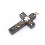 A 19th century pietra dura inlaid cross pendant, inset with lily of the valley, white metal bale,