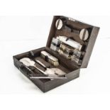 An Art Deco style silver dressing table set by Adie Bros, presented in a fitted case, one scent