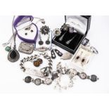 A collection of silver and white metal jewels, including four mystic topaz rings, an identity
